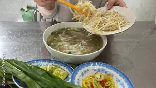 Add sprouted beans, wheat, and mung beans to Vietnamese pho soup photo