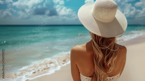 Woman in White Hat Sitting on Beach