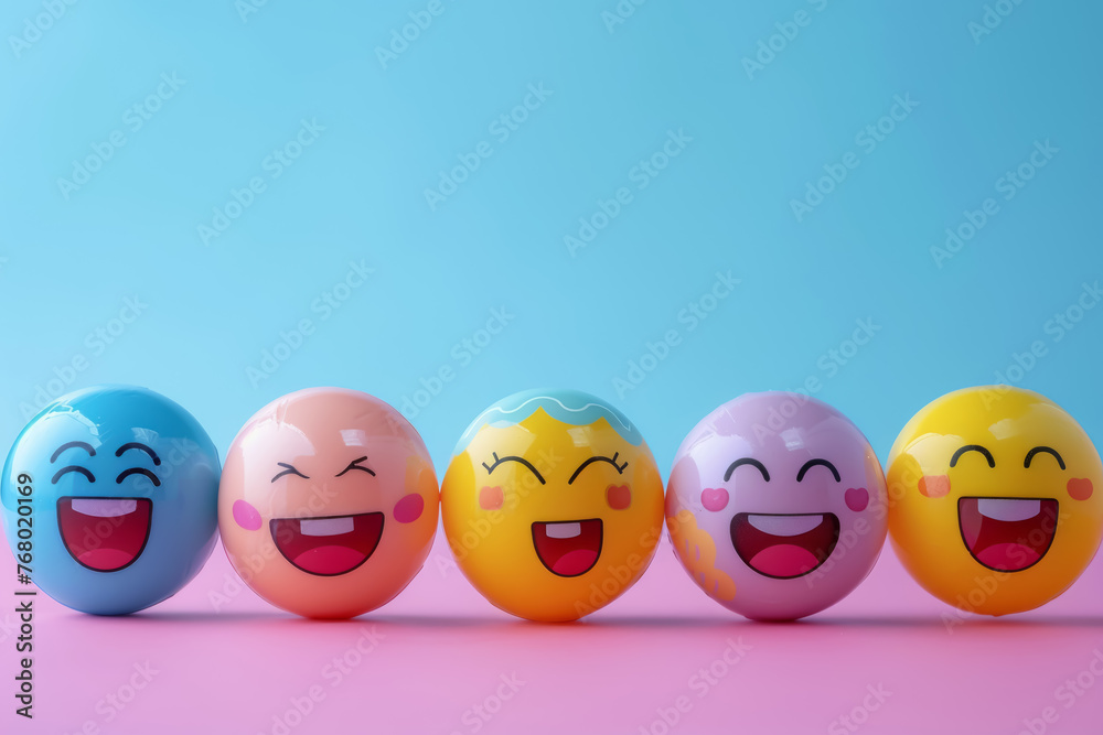 A row of colorful, smiling, happy faces are lined up on a pink background A row of colorful, smiling, happy faces are lined up on a pink background