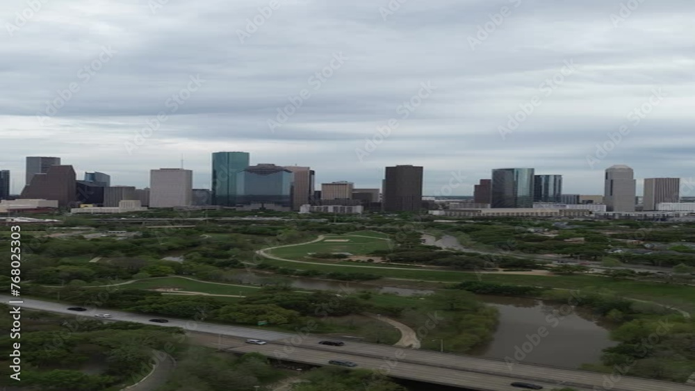 Downtown Houston, Texas skyline with traffic in the background on a busy freeway