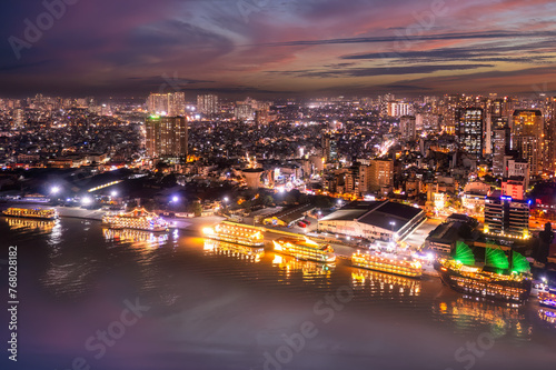 Aerial panoramic cityscape view of HoChiMinh city and the River Saigon, Vietnam with blue sky at sunset. View from Thu Thiem peninsula © VietDung