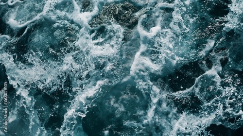 Dynamic close-up of swirling ocean waves and foam symbolizing power and natural beauty.