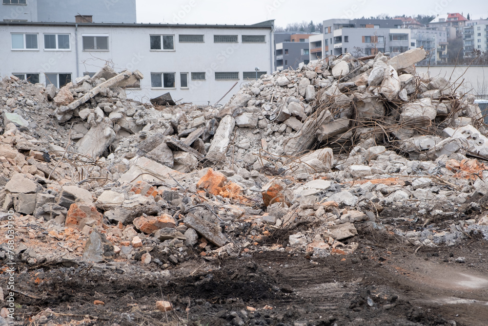Piles of rubble from demolished house walls. Construction ruined destroyed debris. Concept of old house demolition and new construction Piles of rubble from demolished house walls. Construction ruined destroyed debris. Concept of old house demolition and new construction