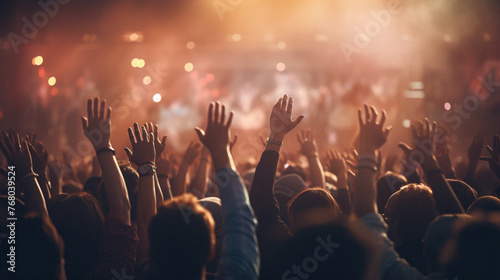 Crowd at a concert - close up of hands raised at a music festival photo