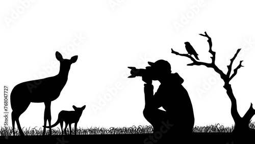 A photographer taking a photo of wild animals in black color.