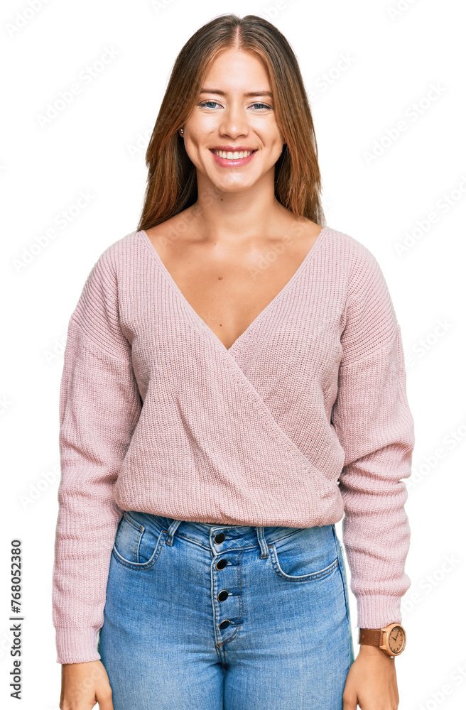 Beautiful blonde woman wearing casual winter pink sweater with a happy and cool smile on face. lucky person.