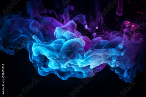 a blue and purple flame against a black background © Michael Böhm