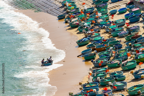 Fishermans And Circle Boats On Sandy Beach Of Vietnam Fishing Village.