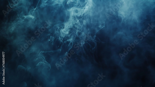Blue smoke on a dark background. Can be used as a background for various purposes.