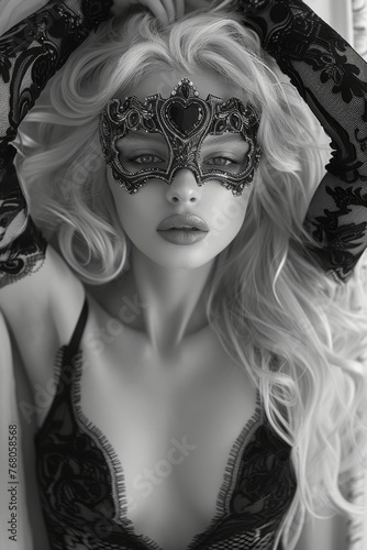 Enigmatic Blonde-Haired Beauty in Elegant Lace and Masquerade Mask, Lying on her Back, Magic and Fantasy in Black and White. 