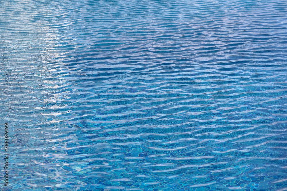 surface of blue swimming pool,background of water in swimming pool. 2 surface of blue swimming pool,background of water in swimming pool. 2