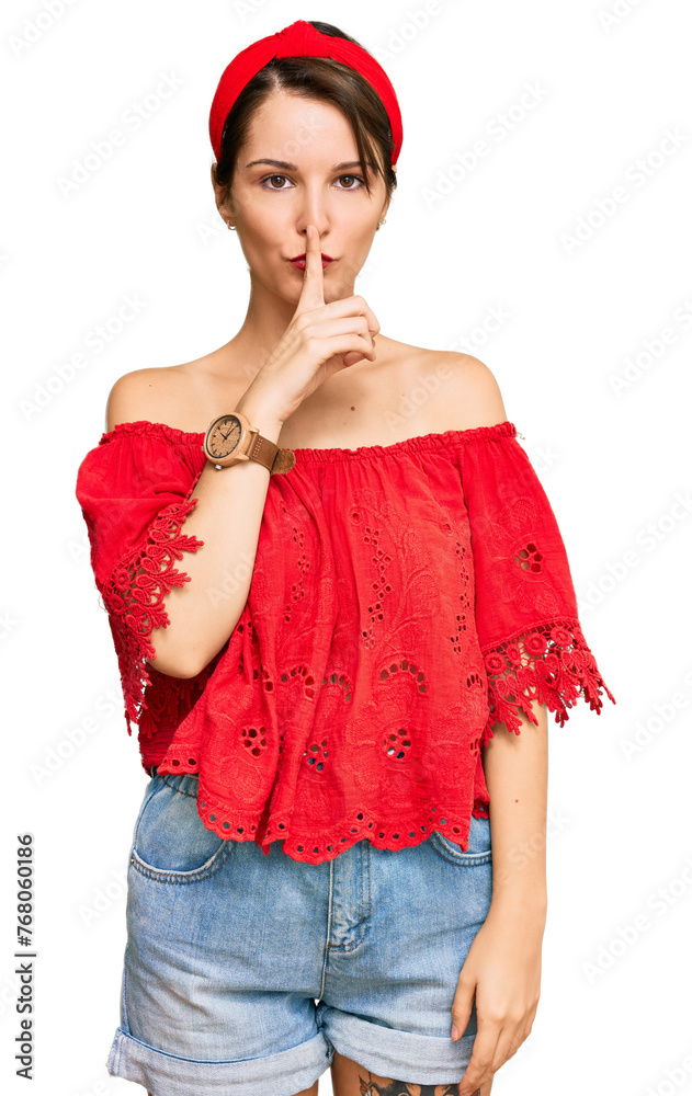 Young brunette woman with short hair wearing casual summer clothes and diadem asking to be quiet with finger on lips. silence and secret concept. Young brunette woman with short hair wearing casual summer clothes and diadem asking to be quiet with finger on lips. silence and secret concept.