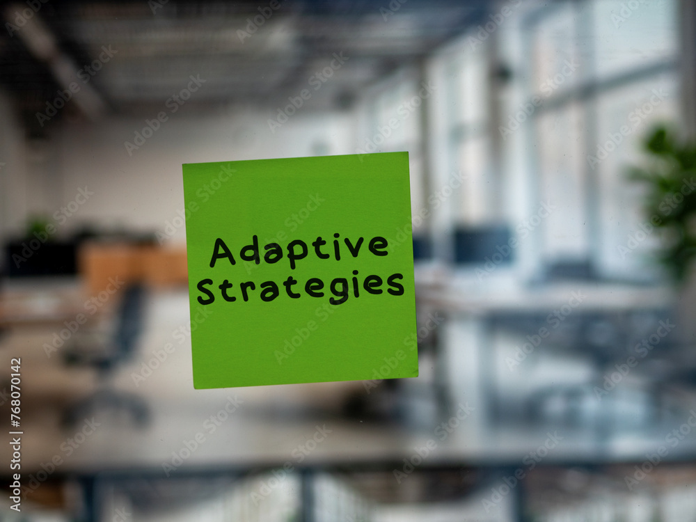 Post note on glass with 'Adaptive Strategies'.