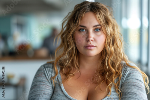 Blonde middle-aged plus size model at home, fat woman with chubby face, body positive concept