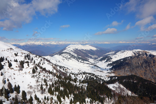 Breathtaking panorama of the European Alps mountain range in winter with snow-capped peaks