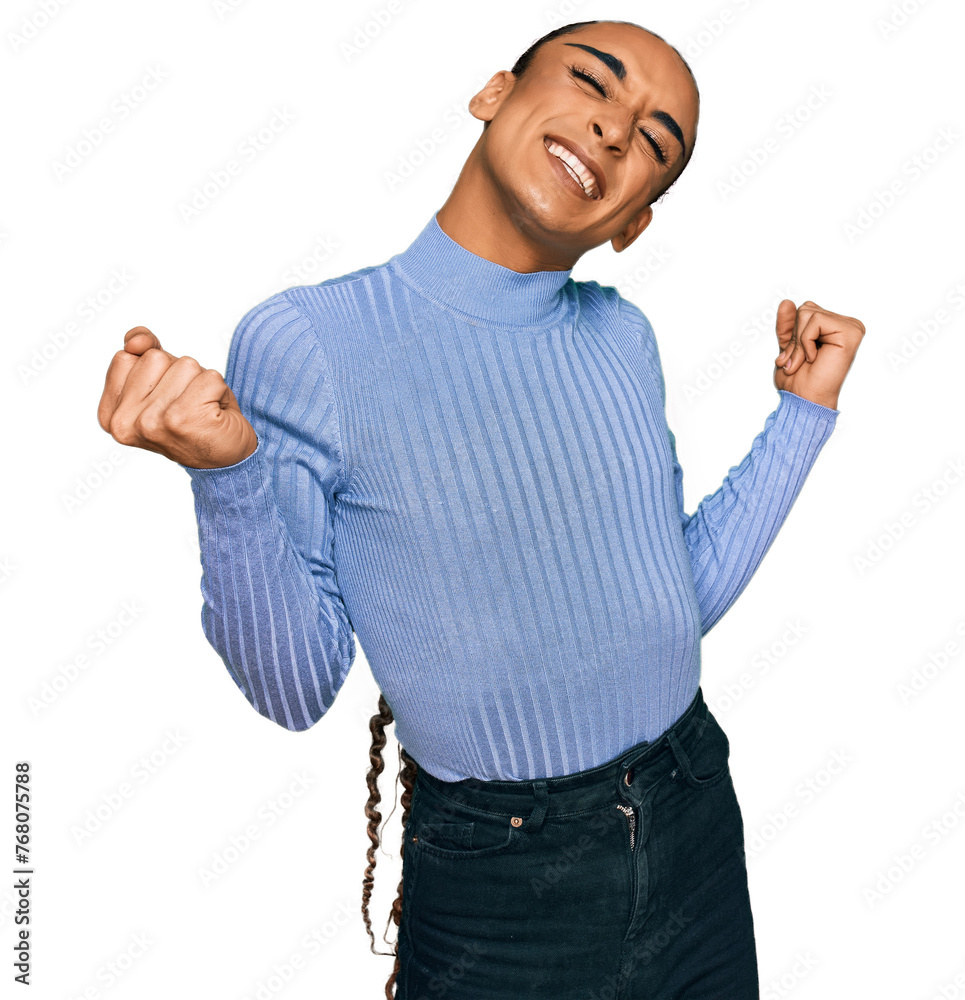 Φωτογραφία Hispanic transgender man wearing make up and long hair wearing casual clothes very happy and excited doing winner gesture with arms raised, smiling and screaming for success