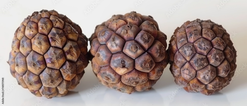Three fruits arranged on a white surface, with a white background Three fruits arranged on a white surface, with a white background