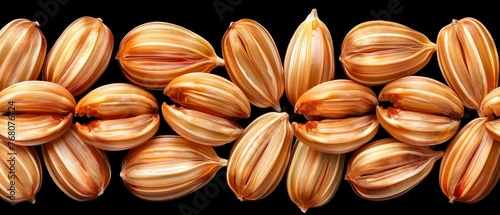  Close-up of black background with reflection of nuts in center