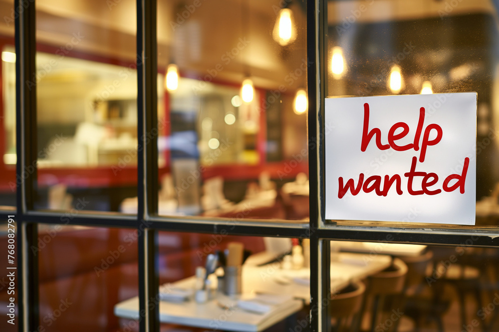 help wanted sign in the window of a restaurant
