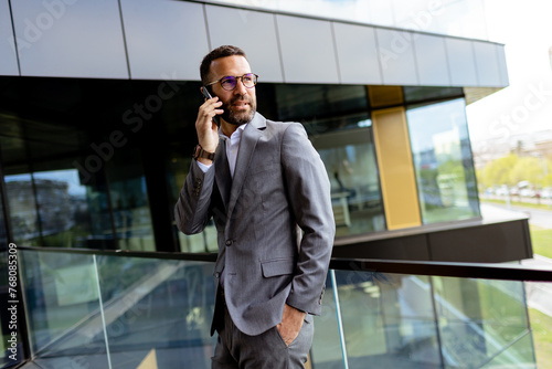 Confident Businessman Smili...