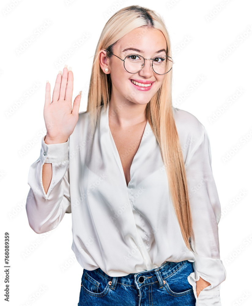 Beautiful blonde woman wearing elegant shirt and glasses waiving saying hello happy and smiling, friendly welcome gesture Beautiful blonde woman wearing elegant shirt and glasses waiving saying hello happy and smiling, friendly welcome gesture