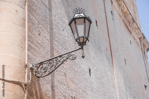 old street lamp on the wall in Lecce in Apulia, southern Italy