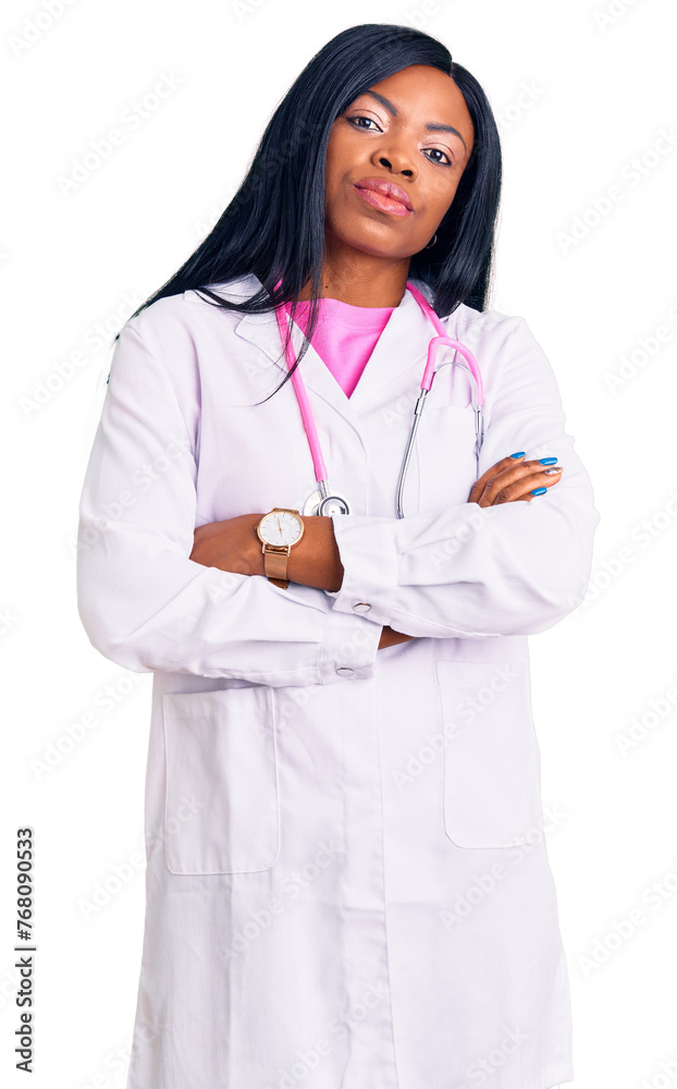 Young african american woman wearing doctor stethoscope looking to the side with arms crossed convinced and confident Young african american woman wearing doctor stethoscope looking to the side with arms crossed convinced and confident