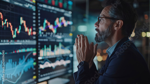 Trader have a tense expression as they look at the stock chart, stock market and investment concept. photo