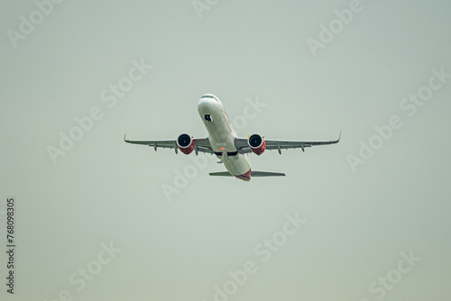 A passenger plane ascending through the skies towards its final destination