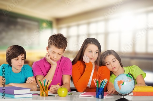 school children study together in the library with books © BillionPhotos.com
