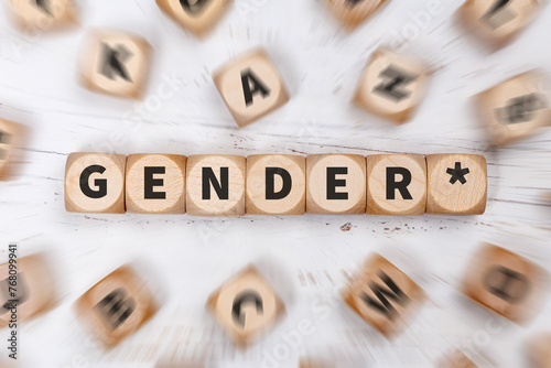 Gendern mit Gendersternchen als Symbol für gendergerechte Sprache auf Würfeln Kommunikation Konzept © Markus Mainka