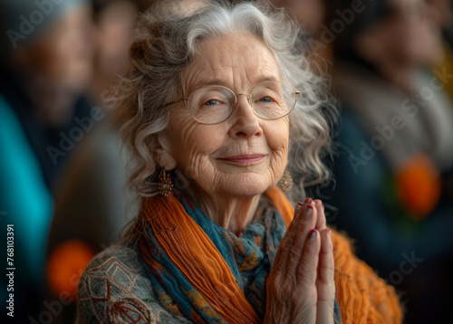 Portrait of senior woman meditating in yoga class