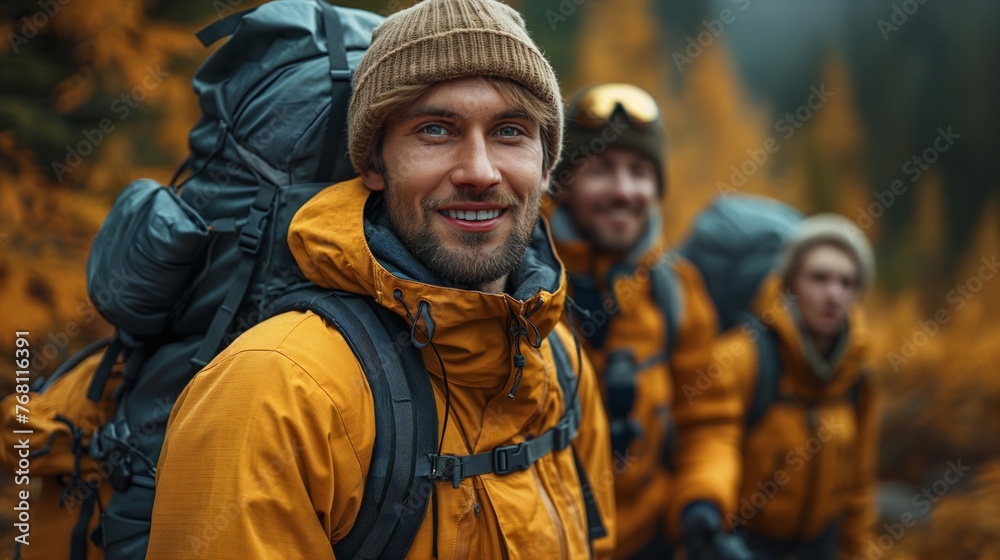 Group of male hikers on the mountain, medium shot, smiling, forest background.