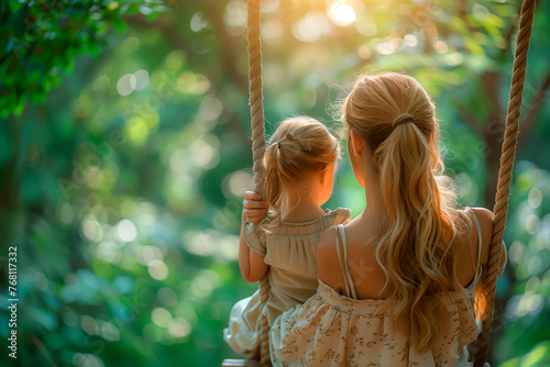 Mother-Daughter Bonding Serenity: Rear View of Woman and Child Swinging on Rustic Swing Set on a Sunny Summer Day in Nature