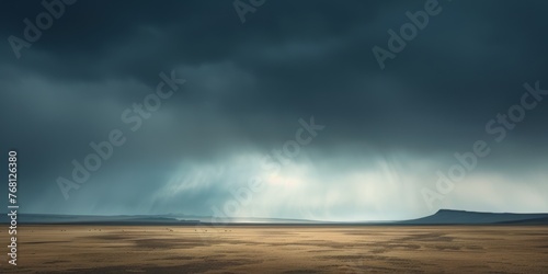 A storm cloud advances over a barren desert landscape. Dramatic Sky Desert