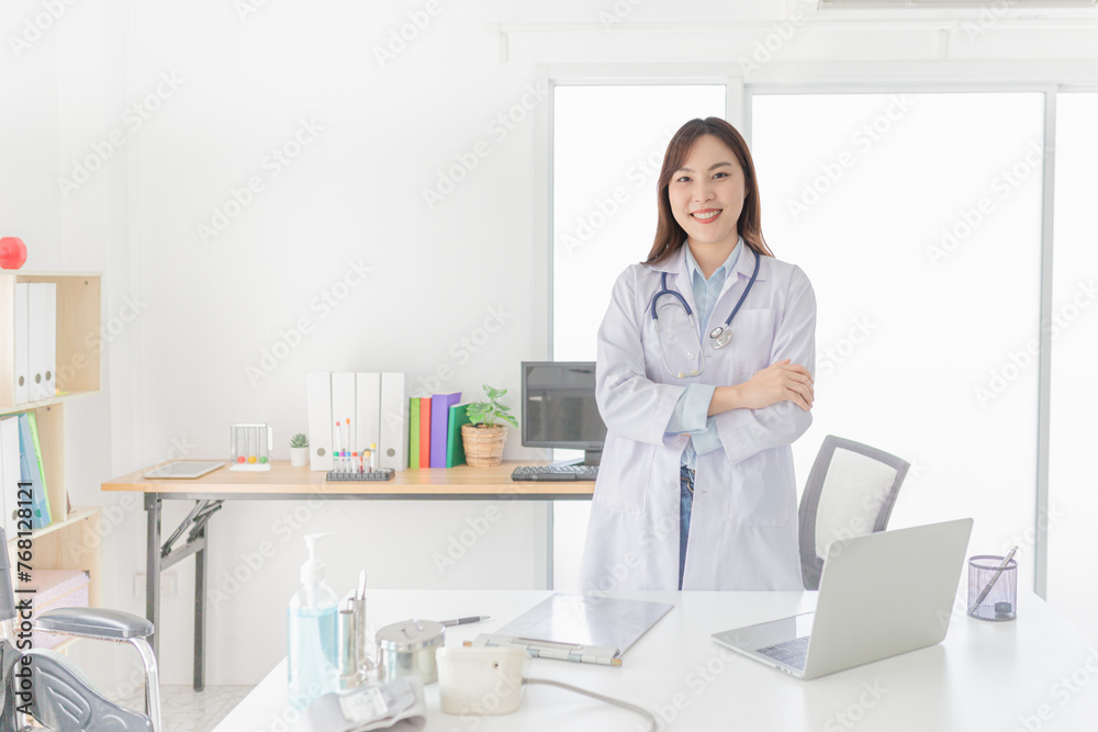 smart female doctor do work in hospital, she stand up and cross arm, she feeling happy in relax time, she ready to service and treatment patient smart female doctor do work in hospital, she stand up and cross arm, she feeling happy in relax time, she ready to service and treatment patient