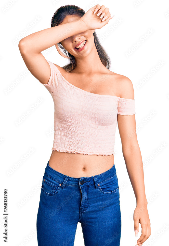 Young beautiful woman wearing casual clothes covering eyes with arm smiling cheerful and funny. blind concept. Young beautiful woman wearing casual clothes covering eyes with arm smiling cheerful and funny. blind concept.