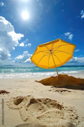 Yellow Beach Umbrella shading from the Summer Sun on the Beach