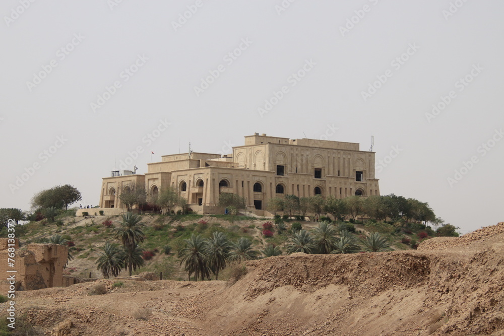 Saddam palace on hill in Babylon with cloudy sky