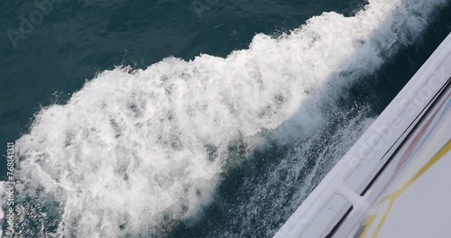 Ship wake up in the ocean. aves from the back of a speed boat over the water's surface in the sea. Waves behind a boat on a clear blue sea