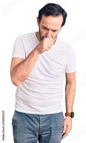 Middle age handsome man wearing casual t-shirt feeling unwell and coughing as symptom for cold or bronchitis. health care concept.