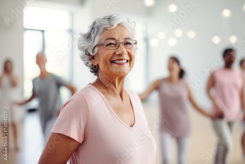 Elderly fitness enthusiasts staying vibrant as they exercise together in the gym, old women practicing yoga