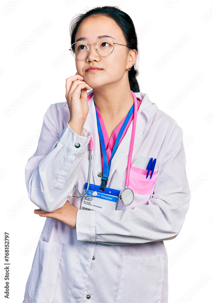Young chinese woman wearing doctor uniform and stethoscope with hand on chin thinking about question, pensive expression. smiling and thoughtful face. doubt concept. Young chinese woman wearing doctor uniform and stethoscope with hand on chin thinking about question, pensive expression. smiling and thoughtful face. doubt concept.