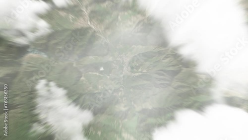 Earth zoom in from space to Trashi Yangtse, Bhutan. Followed by zoom out through clouds and atmosphere into space. Satellite view. Travel intro. Images from NASA photo