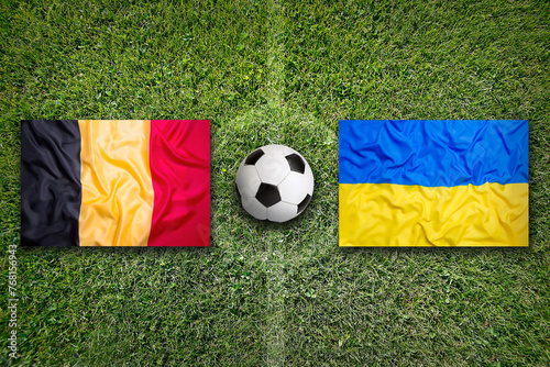 Belgium vs. Ukraine flags on soccer field