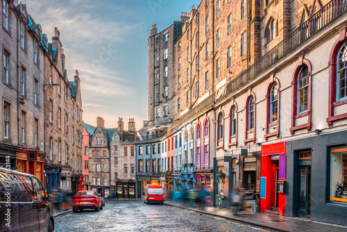 Colorful painted storefronts and old buildings along the famous Victoria Street in Edinburgh Old Town, Scotland