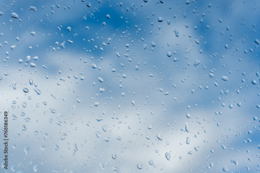 Raindrops on the window and a blurred background Raindrops on the window and a blurred background
