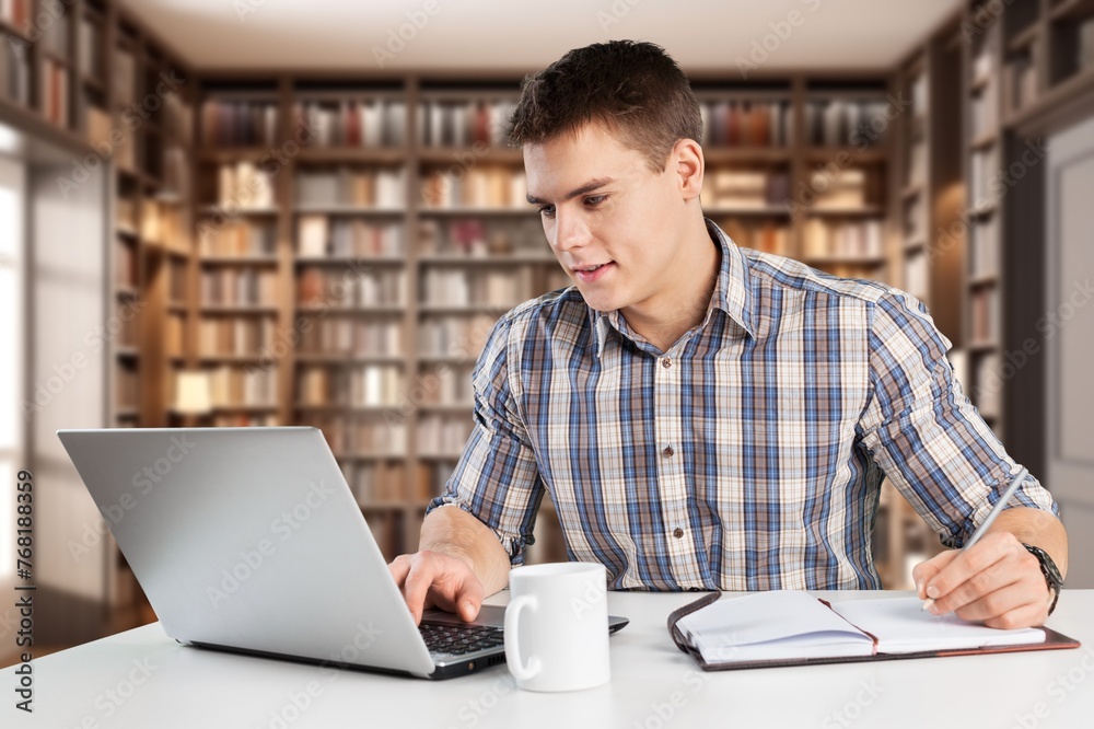 Happy student teenage prepare studying in library Happy student teenage prepare studying in library