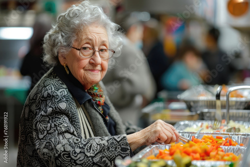 Senior woman in a soup kitchen for the elderly © Michael