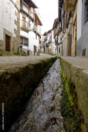 Water flows through the streets of Candelario  Salamanca  Spain.